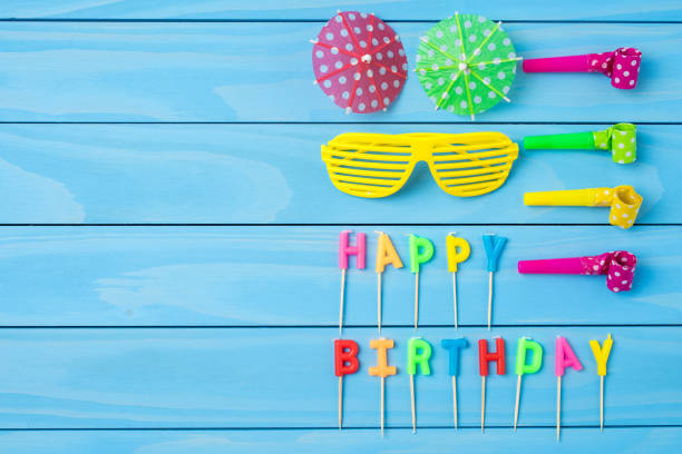 istock Birthday accessories on blue wooden table 817833426
