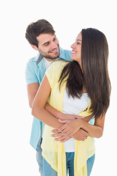 istock Happy casual couple smiling at each other 817833846