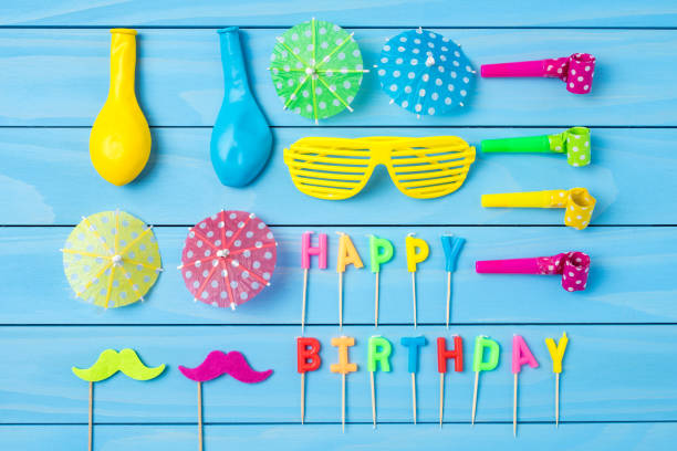 istock Birthday accessories on blue wooden table 817838824