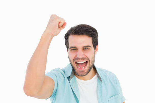 istock Happy casual man cheering at camera 817838900