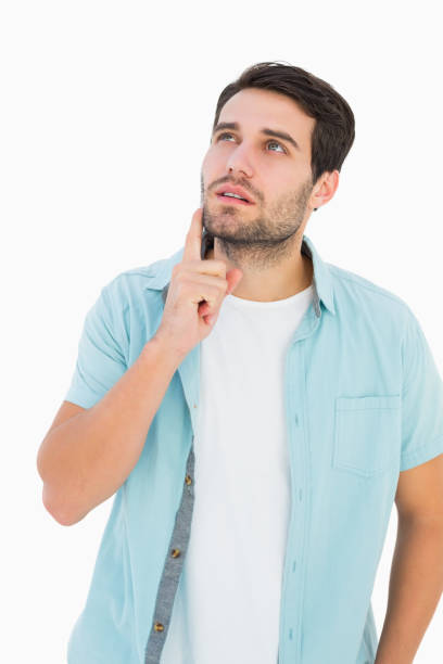 istock Happy casual man thinking with hand on chin 817839168