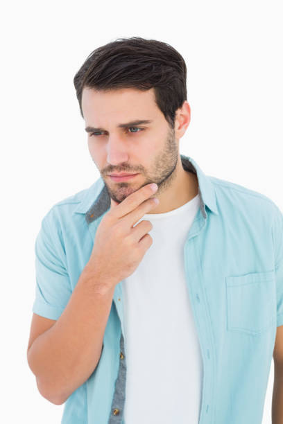 istock Happy casual man thinking with hand on chin 817839224