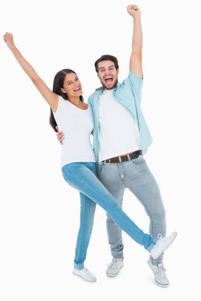 istock Happy casual couple cheering together 817841416