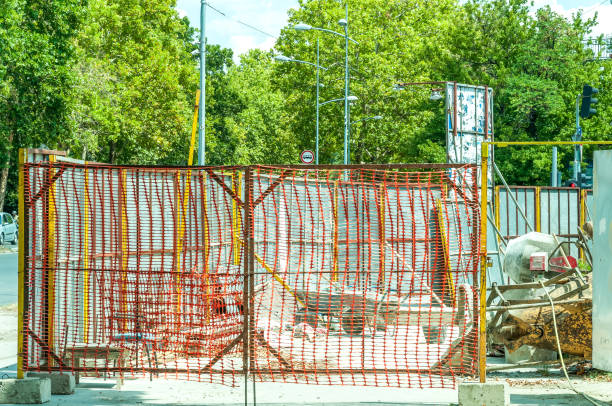 istock Building construction site entrance with gate of construction site safety net. 817841496