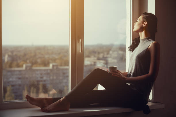 istock Girl resting and thinking at home 817852218