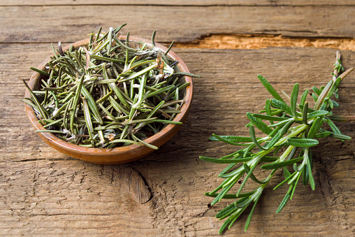 Rosemary plant in a wooden bowl