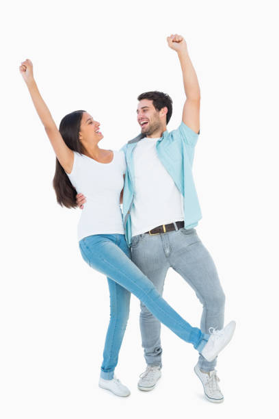 istock Happy casual couple cheering together 817854798