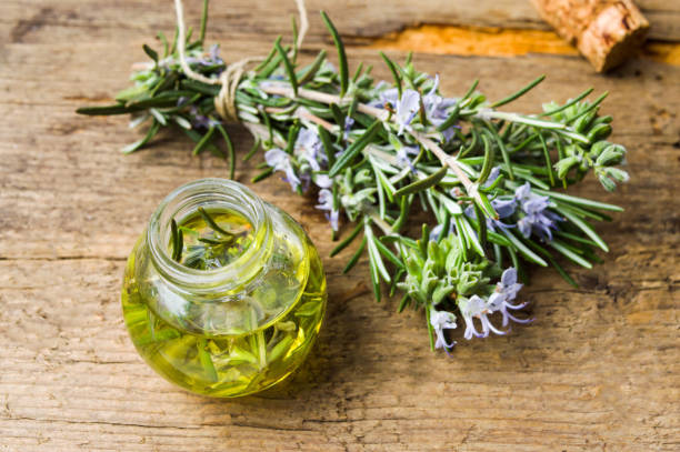 istock Rosemary oil with bouquet in blossom 817859108
