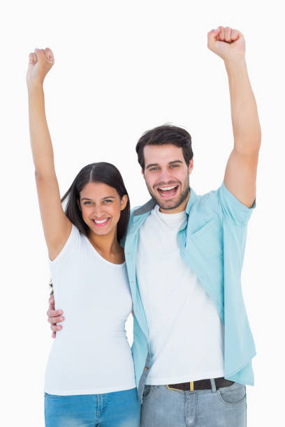 istock Happy casual couple cheering together 817859192
