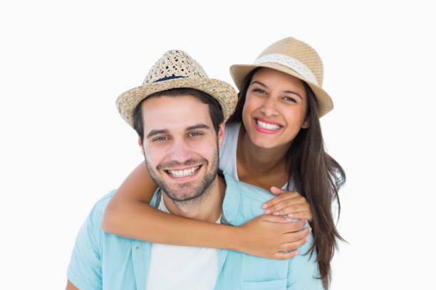 istock Happy casual man giving pretty girlfriend piggy back 817859868