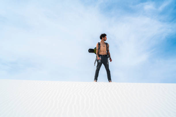istock The young man, traveller, backpacker, exploring the White Sands National Monument, New Mexico 817928062
