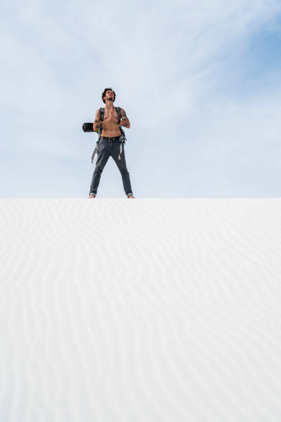 istock The young man, traveller, backpacker, exploring the White Sands National Monument, New Mexico 817928156