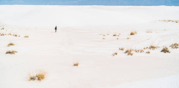 istock The young man, traveller, backpacker, exploring the White Sands National Monument, New Mexico 817928196