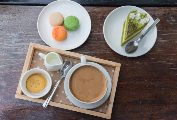 istock hot coffee breakfast set with green tea cake and macaroon 817933346
