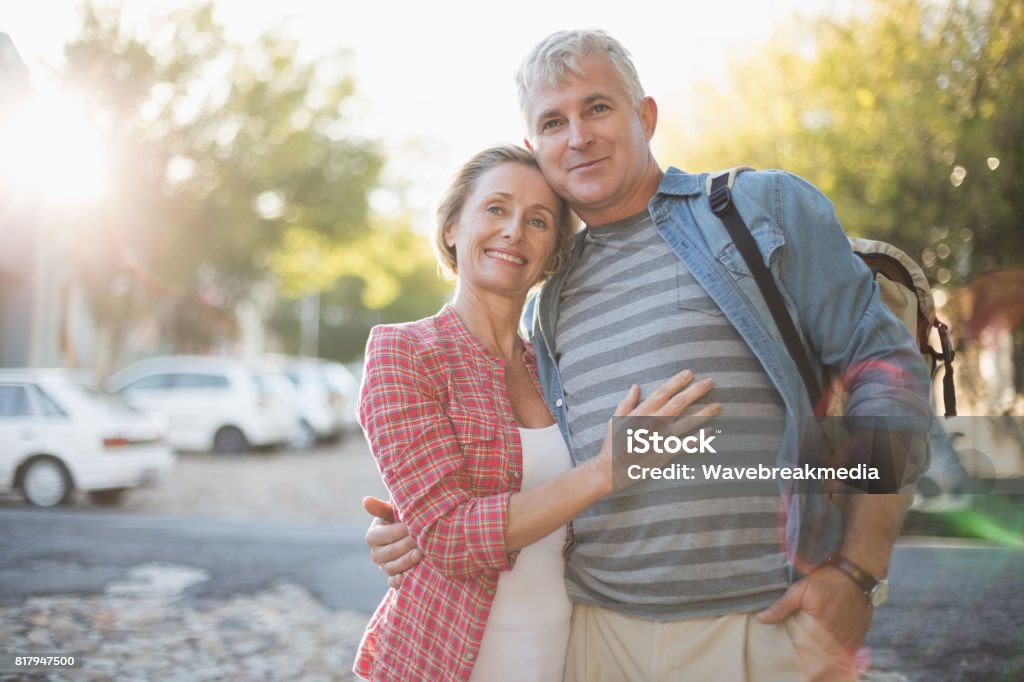 Happy mature couple hugging in the city Happy mature couple hugging in the city on a sunny day 55-59 Years Stock Photo