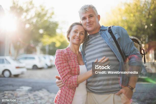 Happy Mature Couple Hugging In The City Stock Photo - Download Image Now - 55-59 Years, Couple - Relationship, 50-54 Years