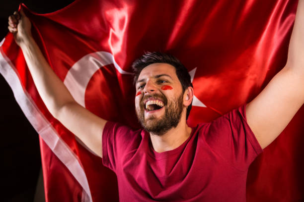 istock Turkish fan holding the national flag 817950054