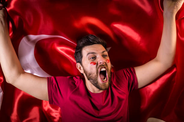 istock Turkish fan holding the national flag 817950062