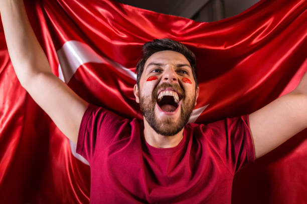 istock Turkish fan holding the national flag 817950094