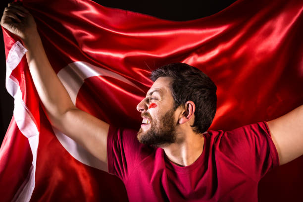 istock Turkish fan holding the national flag 817972248