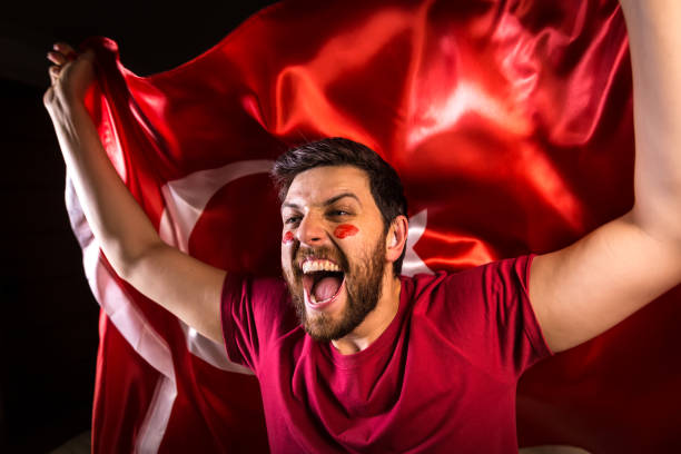istock Turkish fan holding the national flag 817972266