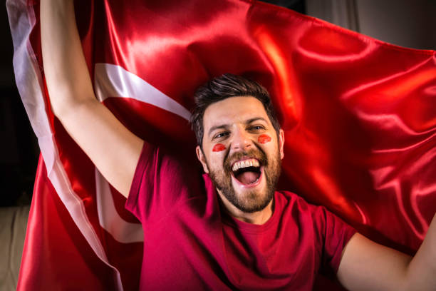 istock Turkish fan holding the national flag 817972274