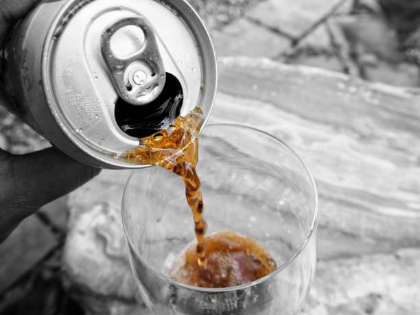 istock Woman pouring cola drink 818000880