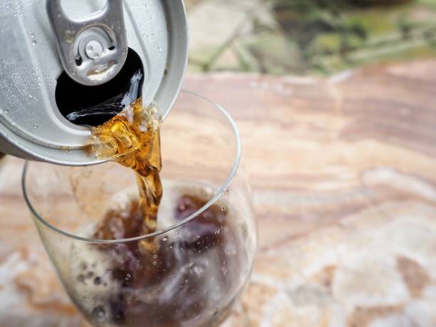istock Woman pouring cola drink 818002928