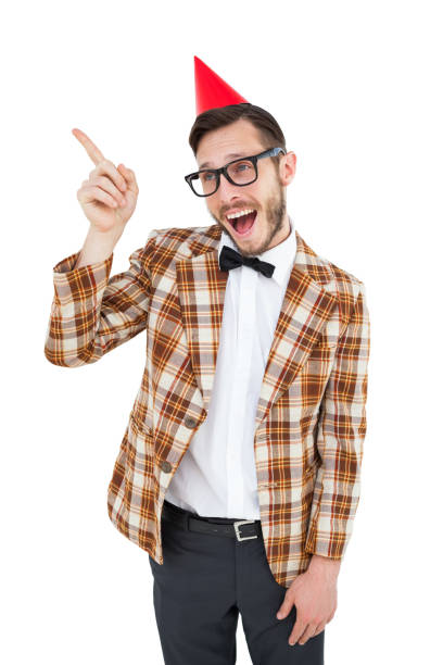 istock Geeky hipster in party hat pointing 818038536