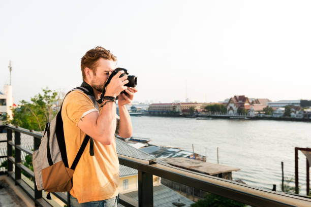 istock Photographer Camera DSLR Shooting Journalist Concept 818051492