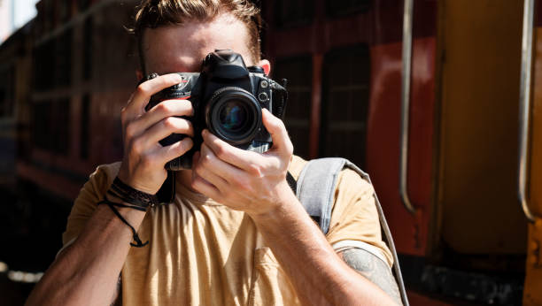 istock Photographer Camera DSLR Shooting Journalist Concept 818052172