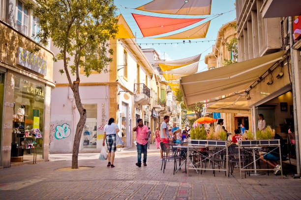 People enjoying a summer in cafes at Ledra street in central Nicosia, Cyprus. Nicosia: People enjoying a summer in cafes at Ledra street in central Nicosia, Cyprus. nicosia cyprus stock pictures, royalty-free photos & images