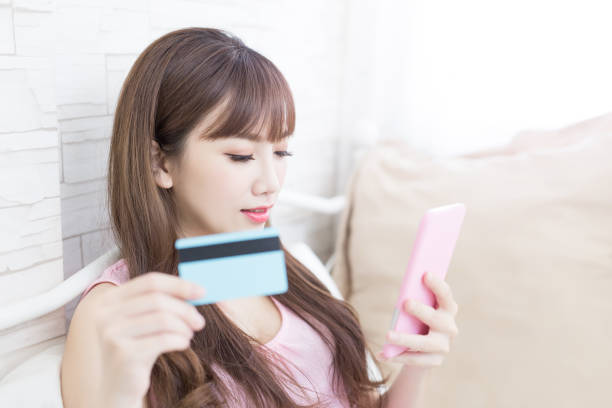 istock woman take credit card 818058772