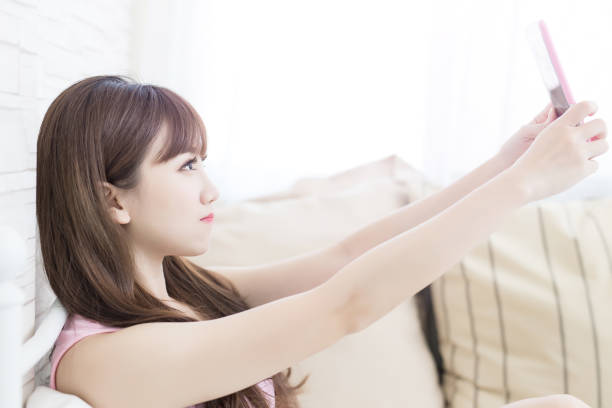 istock beauty woman selfie 818058974