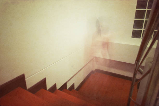 istock Horror photo with a ghost on the staircase. Add noise to image 818064554