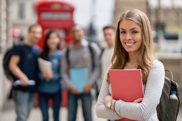 istock Happy female student in London looking at the camera smiling 818087540