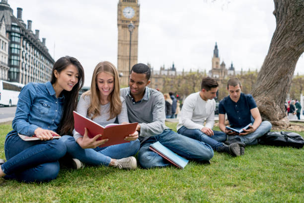 istock Group of students studying outdoors in London 818087822