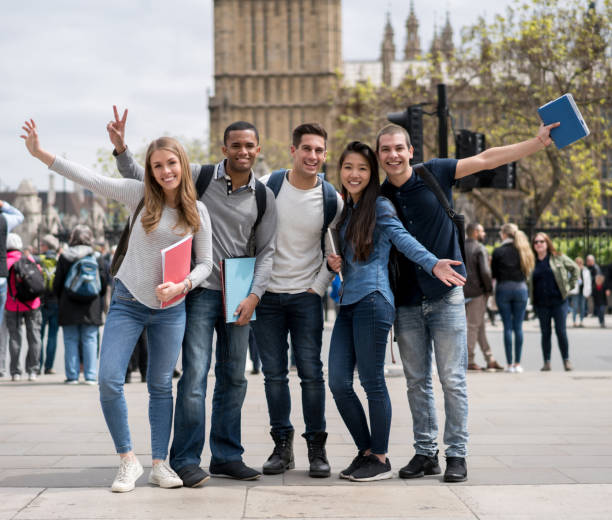 istock Happy group of exchange students in London 818087926