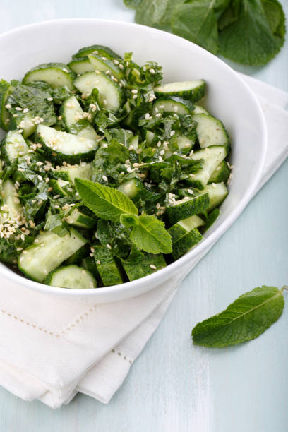 istock Cucumber salad with mint and sesame seeds 818092932