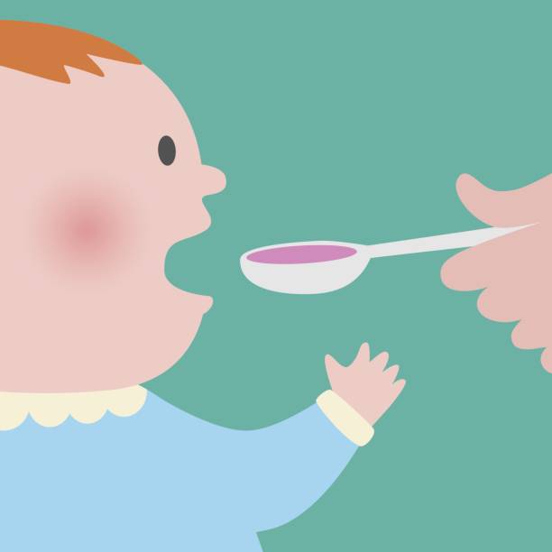 The baby taking spoon of syrup medicine Close up of baby taking spoon of pink syrup medicine hospital humor cartoon stock illustrations