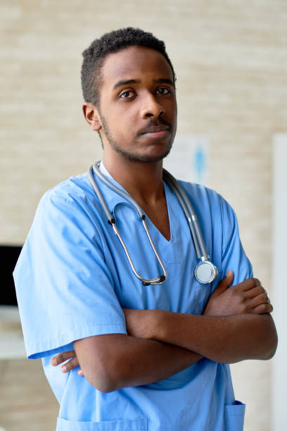 istock Serious young male nurse 818115684