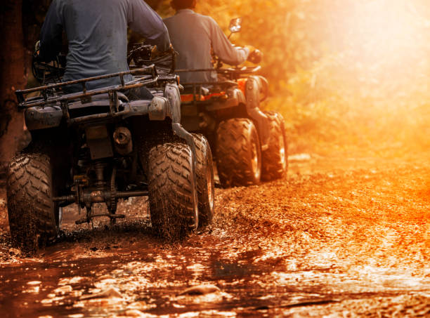 man riding atv vehicle on off road track ,people outdoor sport activitiies theme man riding atv vehicle on off road track ,people outdoor sport activitiies theme quadbike photos stock pictures, royalty-free photos & images