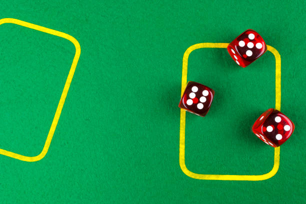 istock risk concept - playing dice on a green gaming table. Playing a game with dice. Red casino dice rolls. Rolling the dice concept for business risk, chance, good luck or gambling 818169632
