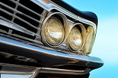Close up of headlight lamp retro  vintage car. The car is older than 1985
