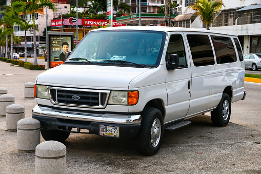 ACAPULCO, MEXICO - MAY 28, 2017: White van Ford E-series in the city street.