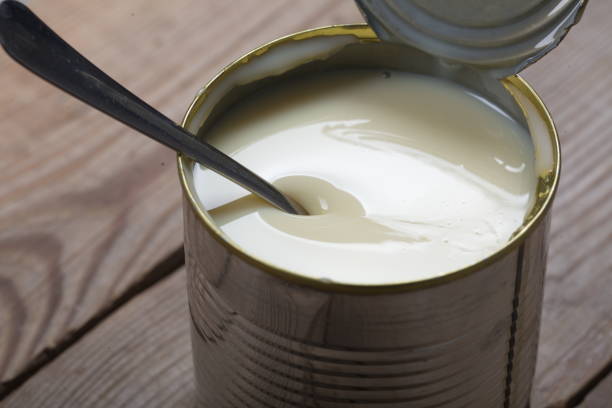 istock Open jar of condensed milk 818176586