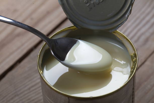 istock Open jar of condensed milk 818176650