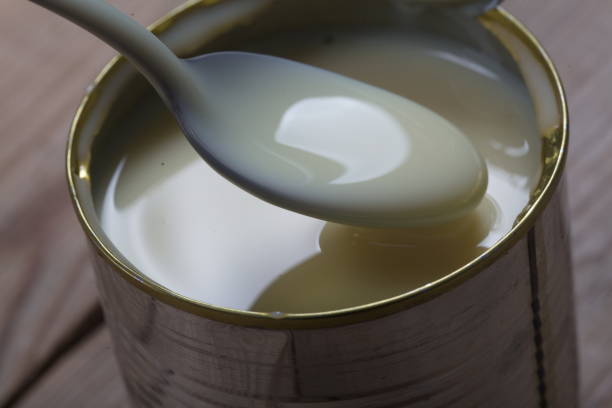 istock Open jar of condensed milk 818176934
