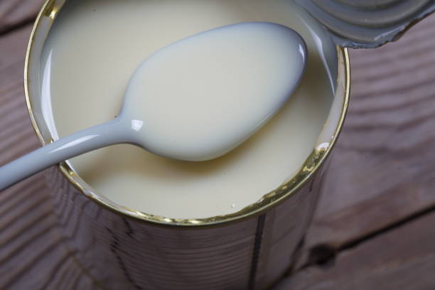 istock Open jar of condensed milk 818176944