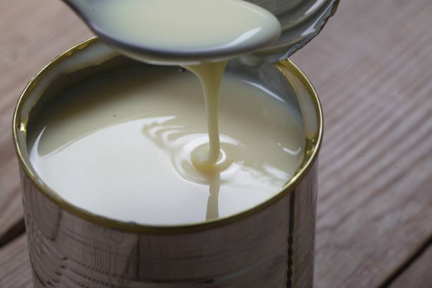 istock Open jar of condensed milk 818177088